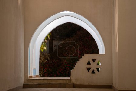 Photo for Archway on a white wall at night on the street of Egypt in Sharm El Sheikh, Africa, architecture concept - Royalty Free Image
