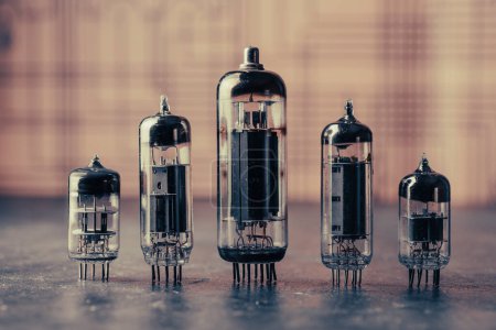 Photo for Old diode lamps of different sizes on a table, close up. Several different vacuum tubes for old radio and TV - Royalty Free Image