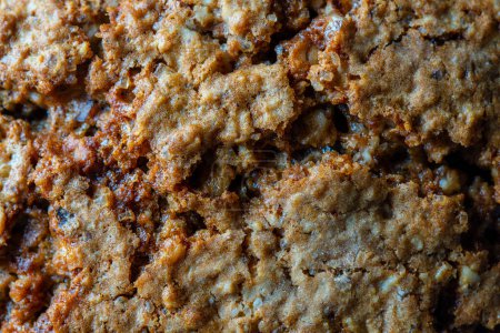 Photo for Crust on oat cookies as an abstract background or texture, close up, top view, macro - Royalty Free Image