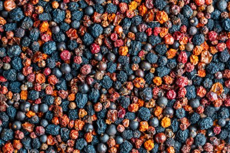 Foto de Homemade dried wild berries in background, close up, top view. Food background. Healthy food, mix of colorful dry berry - Imagen libre de derechos