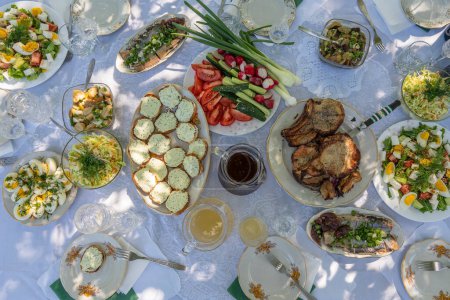 Photo for Top of view full table of ukrainian meals on the table for eat. Table with many ready meals and food, outdoors, close up - Royalty Free Image