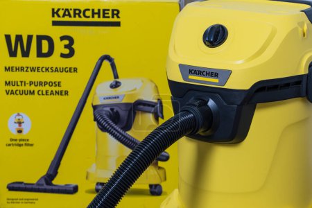 Photo for Kyiv, Ukraine - Jan 23, 2023: Karcher WD 3 V wet and dry vacuum cleaner. Yellow Karcher vacuum cleaner and box , close up - Royalty Free Image