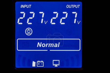 Photo for Close up of blue digital display on uninterruptible power supply with automatic voltage stabilizer - Royalty Free Image