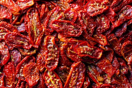 Photo for Sun dried red tomato, close up, top view. Background and texture of dried red tomatoes - Royalty Free Image