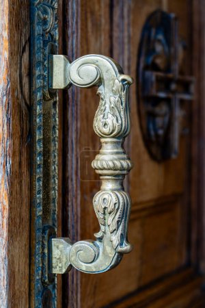 Photo for Ancient door handle on a wooden door in church, Kyiv, Ukraine. Close up - Royalty Free Image