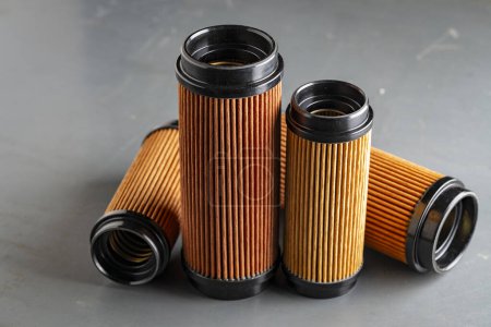 Photo for Air filters for engine car on grey background, close up. Auto parts accessories for retro cars - Royalty Free Image