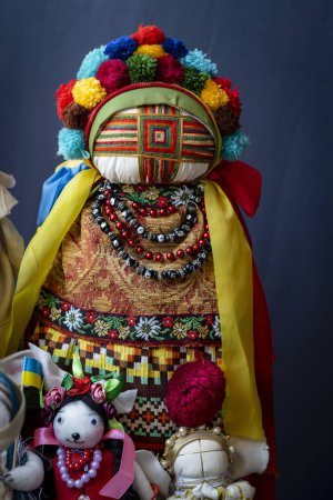 Photo for Close-up of a traditional amulet doll for sale to tourists at a street market in Kyiv, Ukraine. Ukrainian motanka dolls - Royalty Free Image