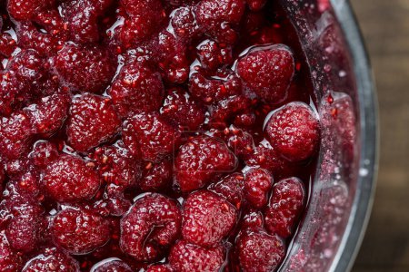 Photo for Fresh red raspberry berry, covered with granulated sugar for jam preparation in bowl, top view, close up. Background and texture of raspberries with sugar - Royalty Free Image