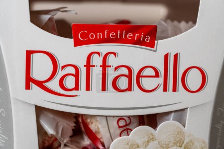 Photo for Kyiv, Ukraine - March 10, 2024 : Box of Ferrero Raffaello premium sweets produced by the Italian chocolatier Ferrero SpA, close up. Raffaello is a spherical coconut almond confection - Royalty Free Image
