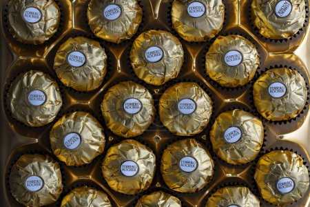 Photo for Kyiv, Ukraine - May 25, 2024 : Box of Ferrero Rocher premium chocolate sweets produced by the Italian chocolatier Ferrero SpA, close up, top view - Royalty Free Image