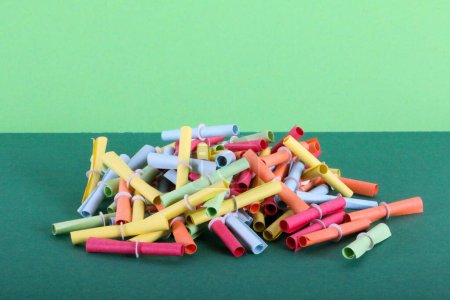 Photo for Close up of a heap of colorful tombola tickets on a colorful background - Royalty Free Image