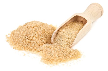 Photo for Brown cane sugar with scoop on white background - Royalty Free Image