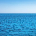 Blue calm sea ocean water and sky