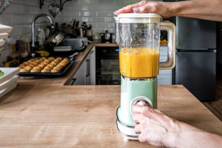 Photo for Electric vintage blender for make fresh orange fruit juice - Royalty Free Image