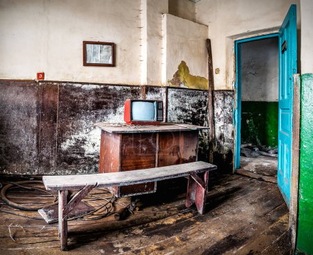 Photo for Ruined abandoned room, Old tv on the retro table, Garbage in the room - Royalty Free Image