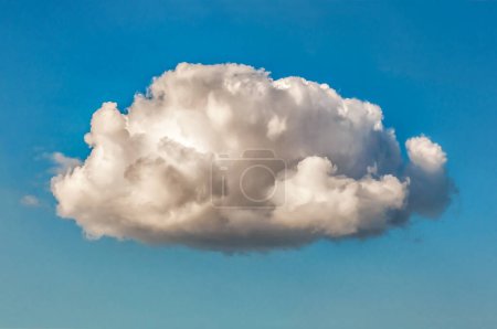 Single fluffy cloud isolated over blue sky background