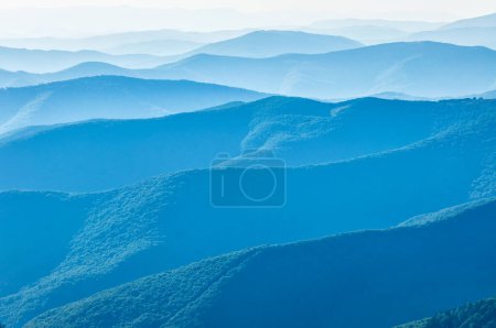 Photo for Sunrise in beautiful Carpathian mountains. Blue mountains waves as a texture - Royalty Free Image