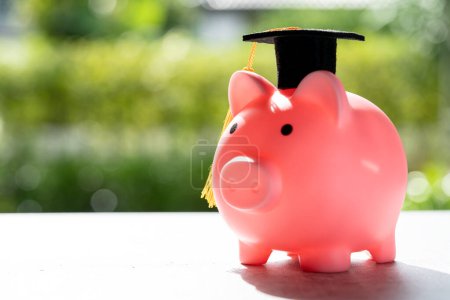 Photo for Save money coins in piggy bank and graduation cap, Business finance education concept. - Royalty Free Image