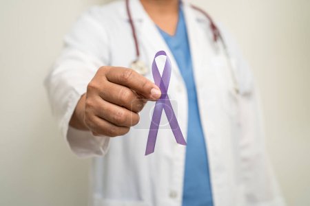 Photo for Asian woman doctor with purple ribbon, sign of Alzheimer disease day, Pancreatic cancer, Epilepsy, Lupus. - Royalty Free Image