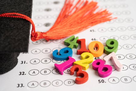 Photo for Math Number colorful  with graduation hat and pencil on Answer sheet background, Education study mathematics learning teach concept. - Royalty Free Image