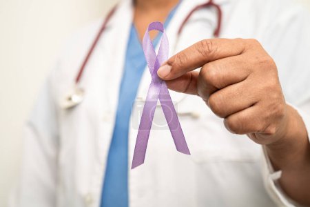 Photo for Asian woman doctor with purple ribbon, sign of Alzheimer disease day, Pancreatic cancer, Epilepsy, Lupus. - Royalty Free Image