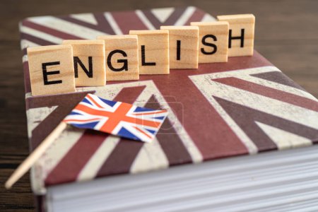 Photo for Word English on book with United Kingdom flag, learning English language courses concept. - Royalty Free Image
