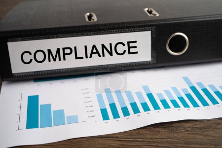 Téléchargez les photos : Compliance. Binder data finance report business with graph analysis in office. - en image libre de droit