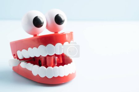 Tooth funny toy denture red color jaw and eye.