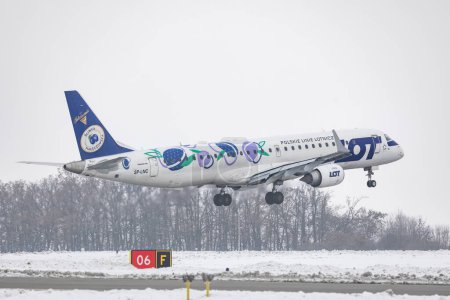 Photo for PRAGUE-December 8,2023: LOT Polish Airlines (Sliwka Naleczowska Livery) Embraer E195LR REG: SP-LNC at Vaclav Havel Airport Prague. LOT Polish Airlines is the flag carrier of Poland. - Royalty Free Image