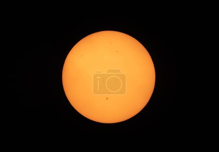 Photo for Sunspots on the sun seen due to forest fires taken June 6 2023 in Ottawa, Canada - Royalty Free Image