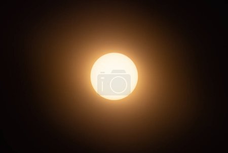 Photo for The sun glowing with many sunspots using a homemade solar filter against a black background over Canada - Royalty Free Image