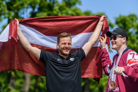 Photo for RIGA, LATVIA. 29th May 2023. Ralfs Freibergs and Kristaps Zile, IIHF Worlds 2023 Bronze Medalists of Latvian Men's Ice Hockey team arrival massive celebration at Monument of Freedom. - Royalty Free Image