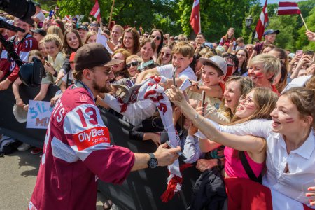 Photo for RIGA, LATVIA. 29th May 2023. IIHF Worlds Bronze Medalists Latvian Men's Ice Hockey team arrival massive celebration at Monument of Freedom. - Royalty Free Image