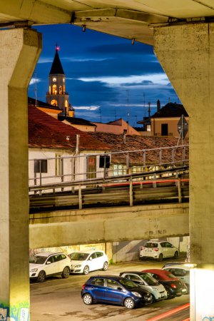 Photo for View of the bell tower of San Cetteo seen from under the motorway junction, Pescara, Italy - Royalty Free Image
