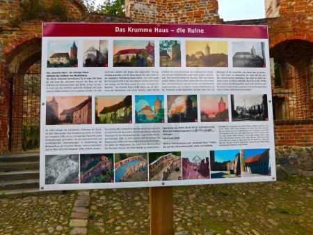 Photo for Stargard Castle, Mecklenburgische Seenplatte district in Mecklenburg-West Pomerania, Germany - August 13, 2023: Plaque with inscription- The crooked house ruin - Royalty Free Image