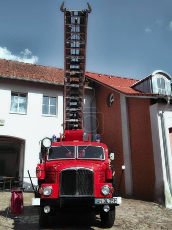 Photo for City of Templin in Uckermark, Brandenburg / Germany - September 2nd, 2023: Vintage truck S4000 with turntable ladder DL 25 of the fire department - Royalty Free Image