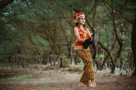 Photo for Portrait young women presenting traditional Javanese dance movements - Royalty Free Image