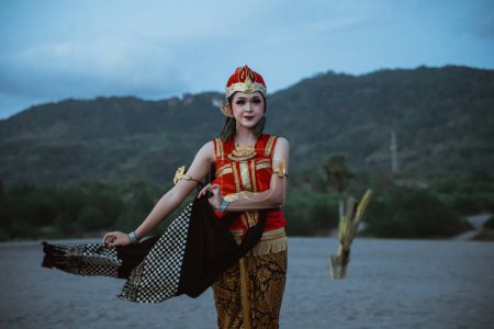 Photo for Portrait young women presenting traditional Javanese dance movements - Royalty Free Image