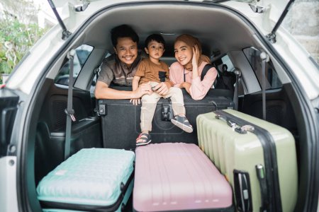 happy asian muslim family going on road trip back home during eid mubarak celebration