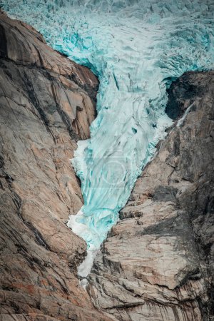 Foto de Briksdalsbreen glacier in the mountains of Jostedalsbreen national park in Norway, blue ice melting in summer - Imagen libre de derechos