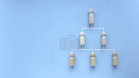 Photo for Company hierarchical organizational chart of blocks on blue background with copy space. - Royalty Free Image