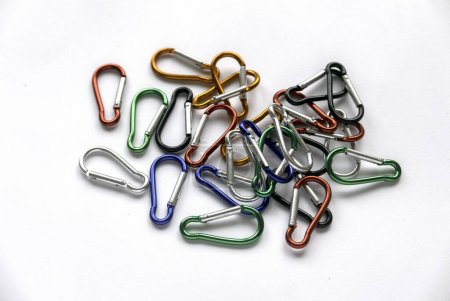 Photo for Multicolor stainless steel construction carabiner isolated on white background. - Royalty Free Image