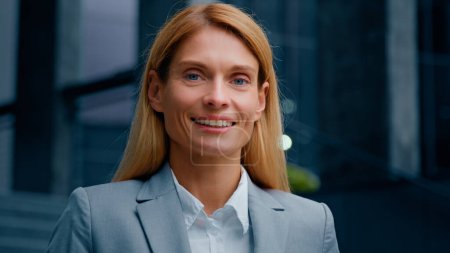 Photo for Headshot inspired motivated successful businesswoman professional manager lawyer leader looking at camera smiling attractive happy caucasian woman satisfied customer standing on street posing outdoors - Royalty Free Image