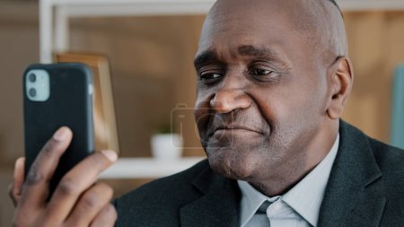 Photo for Closeup male portrait African American 50s old middle-aged businessman emotional professional man online remote conversation manager worker looking in mobile phone camera talking conference video call - Royalty Free Image