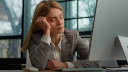 Photo for Tired sleeping lazy napping businesswoman boring with work in office with computer overworked exhausted sick ill woman worker need some rest at workplace sleep nap fatigue burnout manager at table - Royalty Free Image