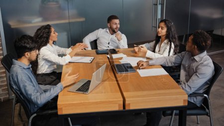 Photo for Multiethnic diverse multiracial colleagues discussing idea project multiethnic business team group people employees workers partners in office brainstorm managers in conference room teamwork discuss - Royalty Free Image