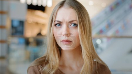 Photo for Close-up female face indoors portrait blond 20s girl millennial woman lady confused female looking at camera with interest searching someone listening attentively waiting puzzled expression emotions - Royalty Free Image