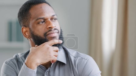 Photo for Close up thoughtful pensive ethnic bearded African American man thinking businessman worker searching solution boss think ponder idea business strategy dreaming pondering in office deep in thoughts - Royalty Free Image