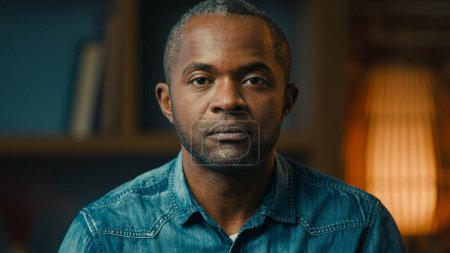 Foto de Close-up male portrait serious sad lonely mature african american man looking at camera desperate unhappy hopeless middle-aged ethnic businessman posing indoors crisis problem concept moving footage - Imagen libre de derechos