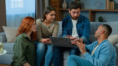 Photo for Multiracial friends working online with laptop order delivery at home diverse group men and women colleagues using computer web app in living room creative team talk discuss ideas startup brainstorm - Royalty Free Image